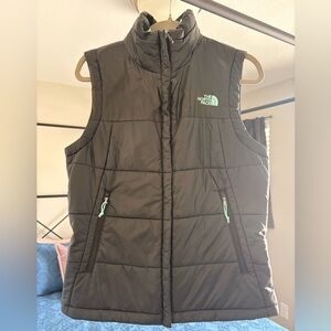 The North Face Women's Black Puffer Vest with Mint Zipper Accents